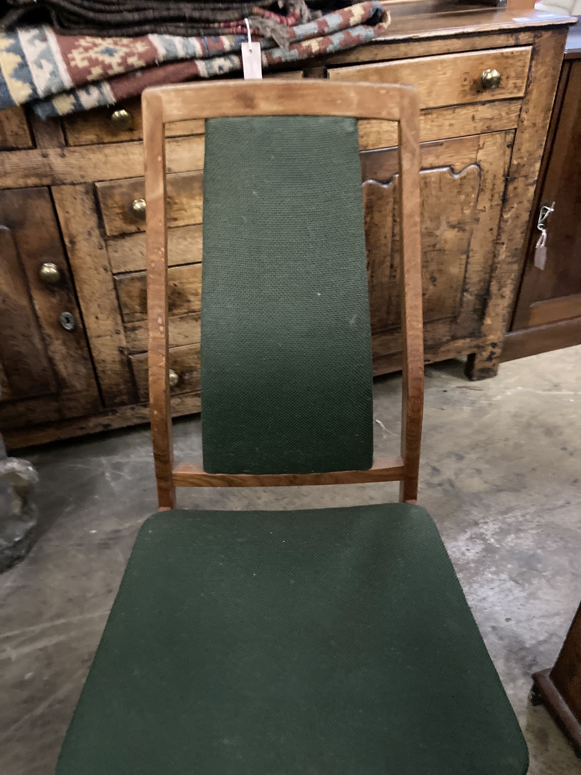 A set of eight mid century design Danish teak high back dining chairs